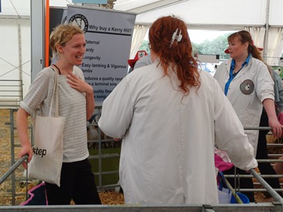 AD|ARC researcher Freya Pryce in conversation with farmers at the Balmoral Show 